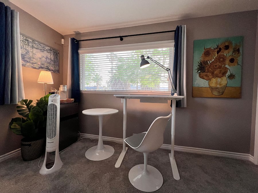 Small Bistro Table, Adjustable Sit/Stand Work Station and Mini-Fridge & Freezer. Includes Personal Coffee or Tea Station. 42" Smart TV