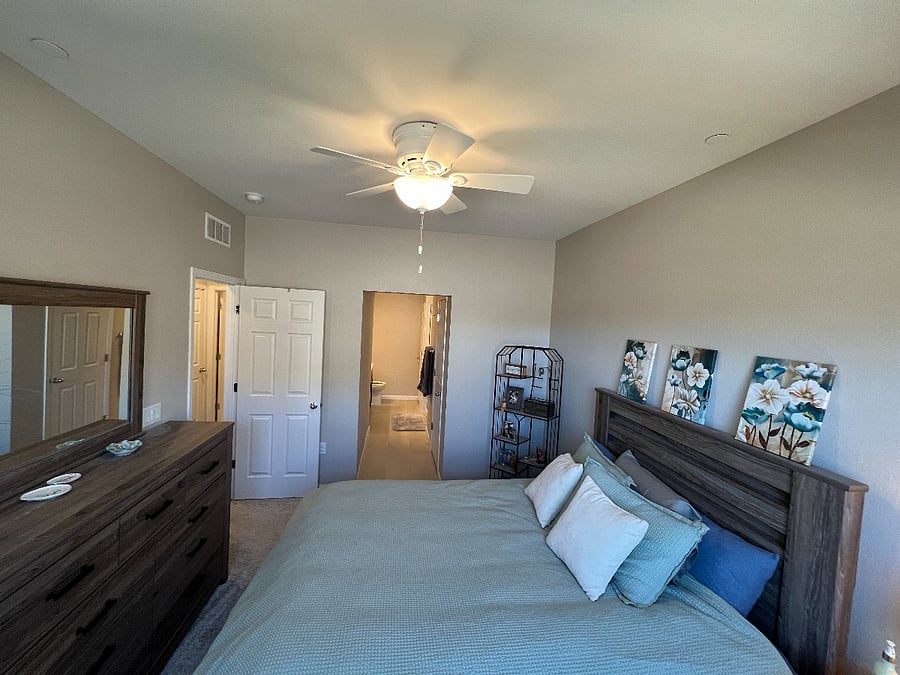 Primary bedroom with attached bathroom