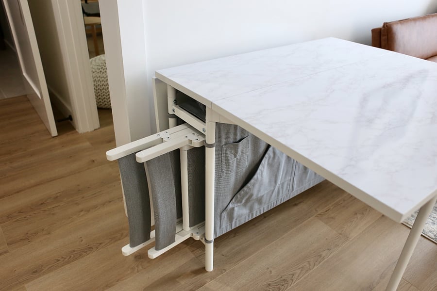 Chairs tucked away in table storage