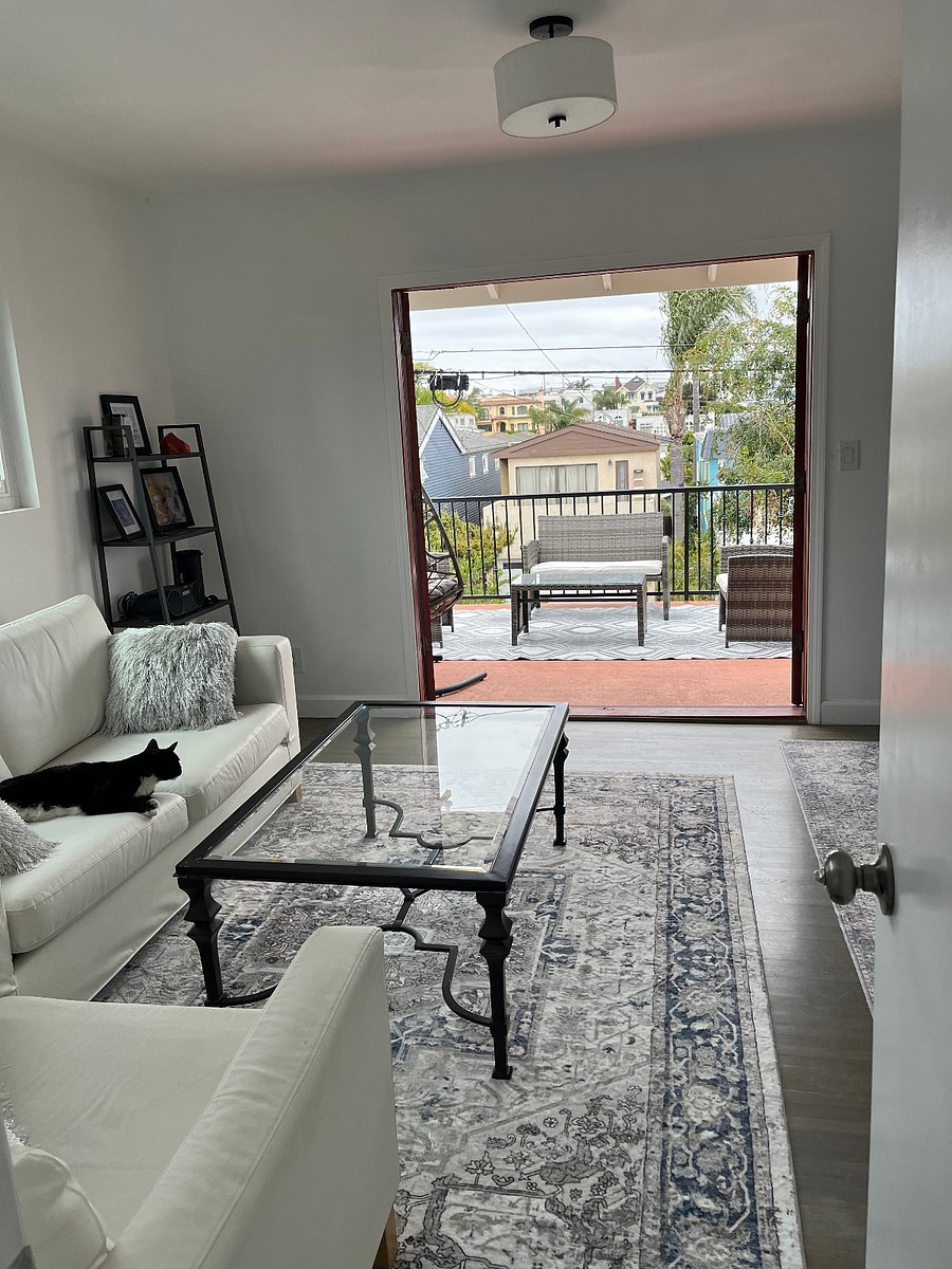 Upstairs TV room with sofa bed and view of the attached deck