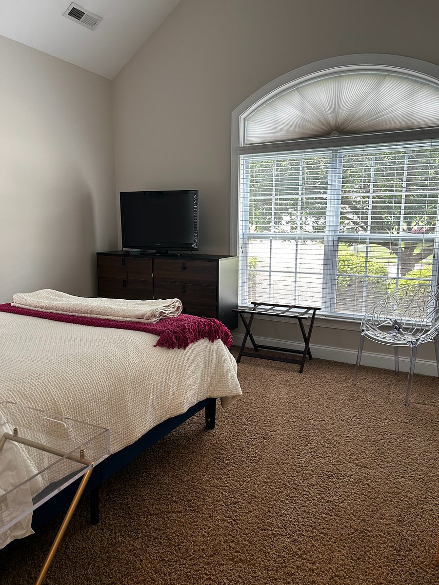 Your bedroom with TV and front window