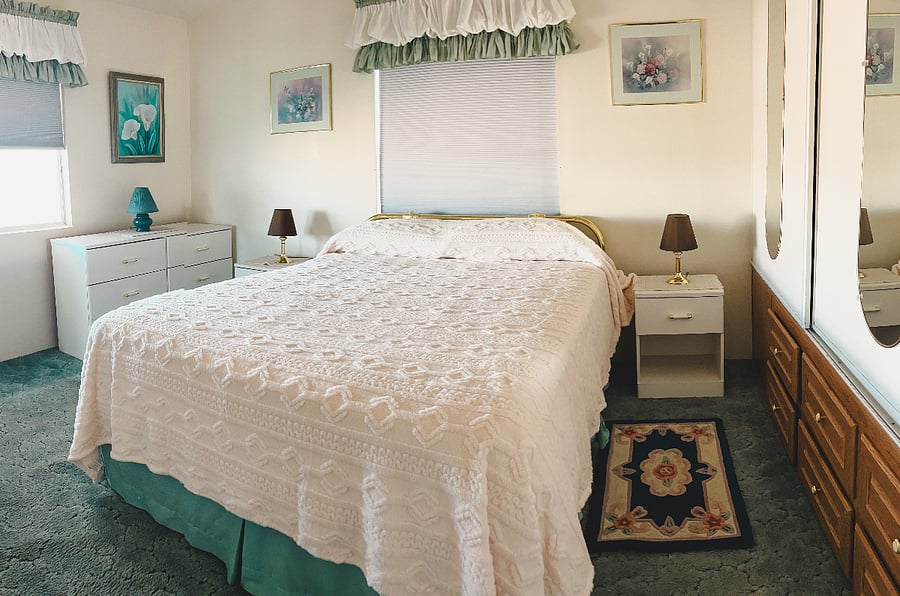 Queen size bed with black out room darkening shades