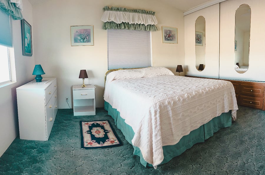 Queen size bed with black out room darkening shade