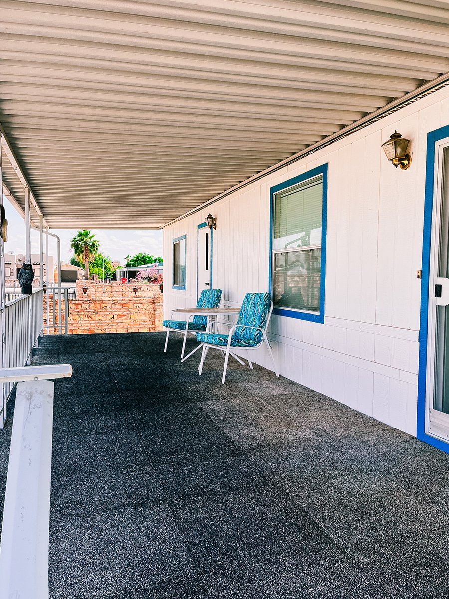 seating with a table on porch with mountain view