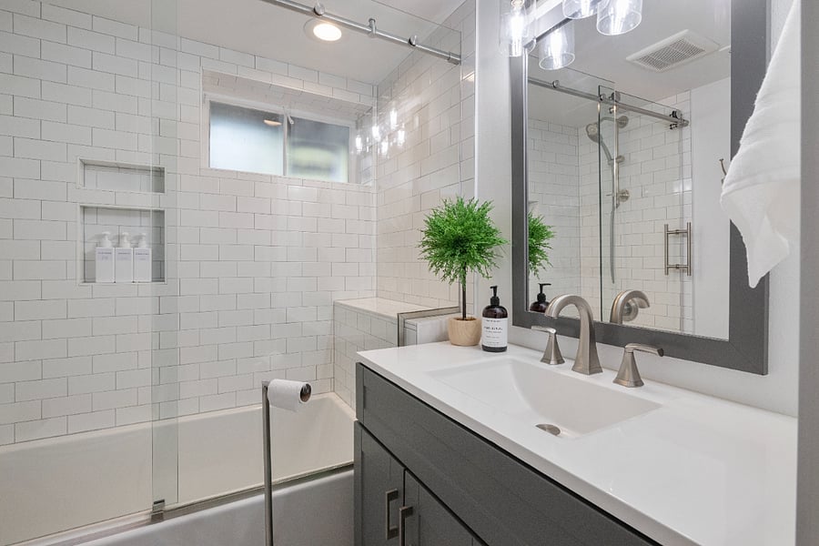 This fully remodeled lower-level bathroom features a full-size tub/shower combo and a window in the shower area for natural light. Conveniently shared by the Domaine, Zenith, and Ankeny rooms, it offers comfort and modern style for your stay read more