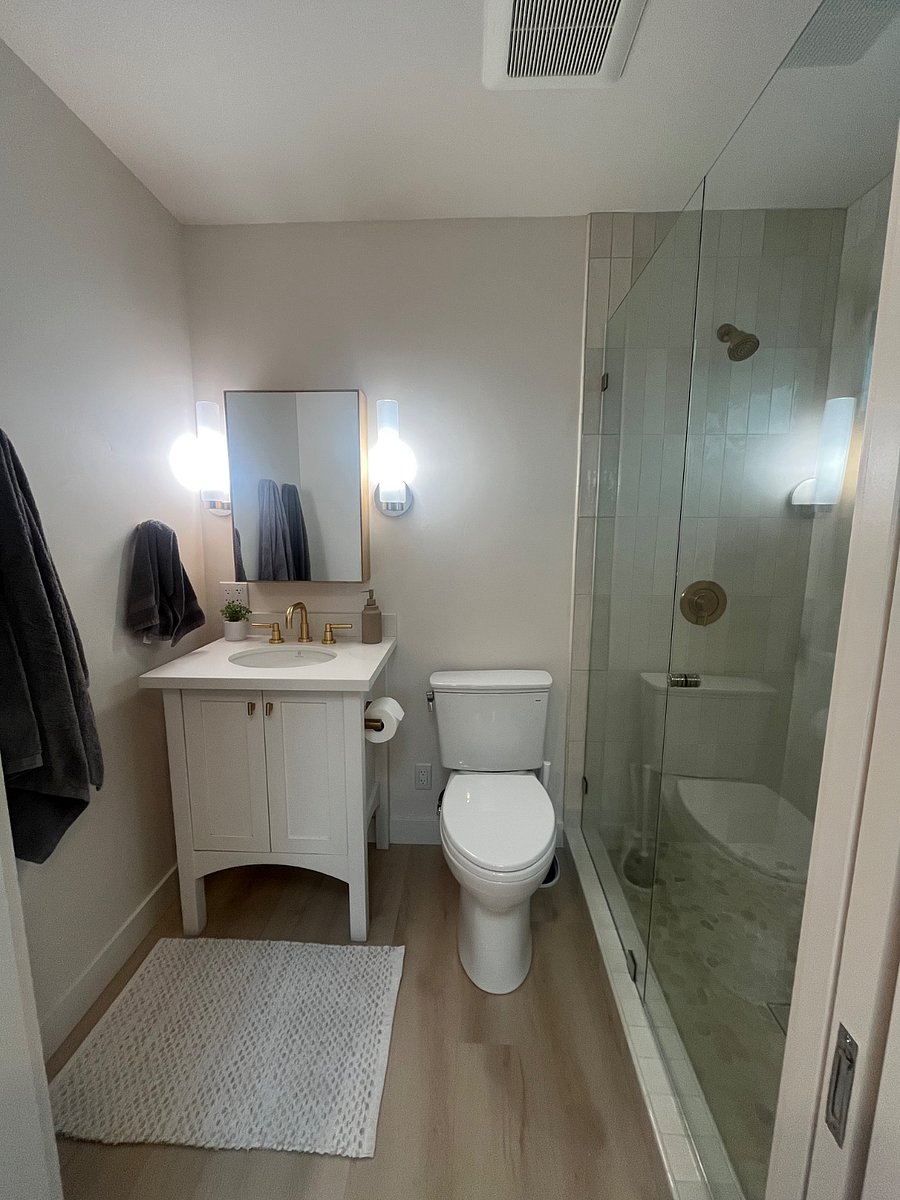 Full bathroom with medicine cabinet for storage and a walk in shower