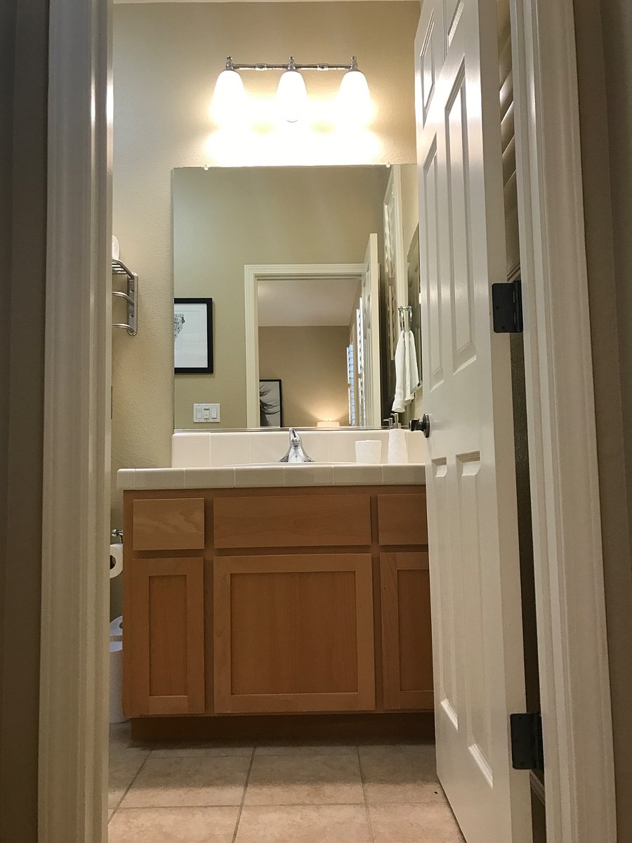 The bathroom is adjacent to the bedroom. 