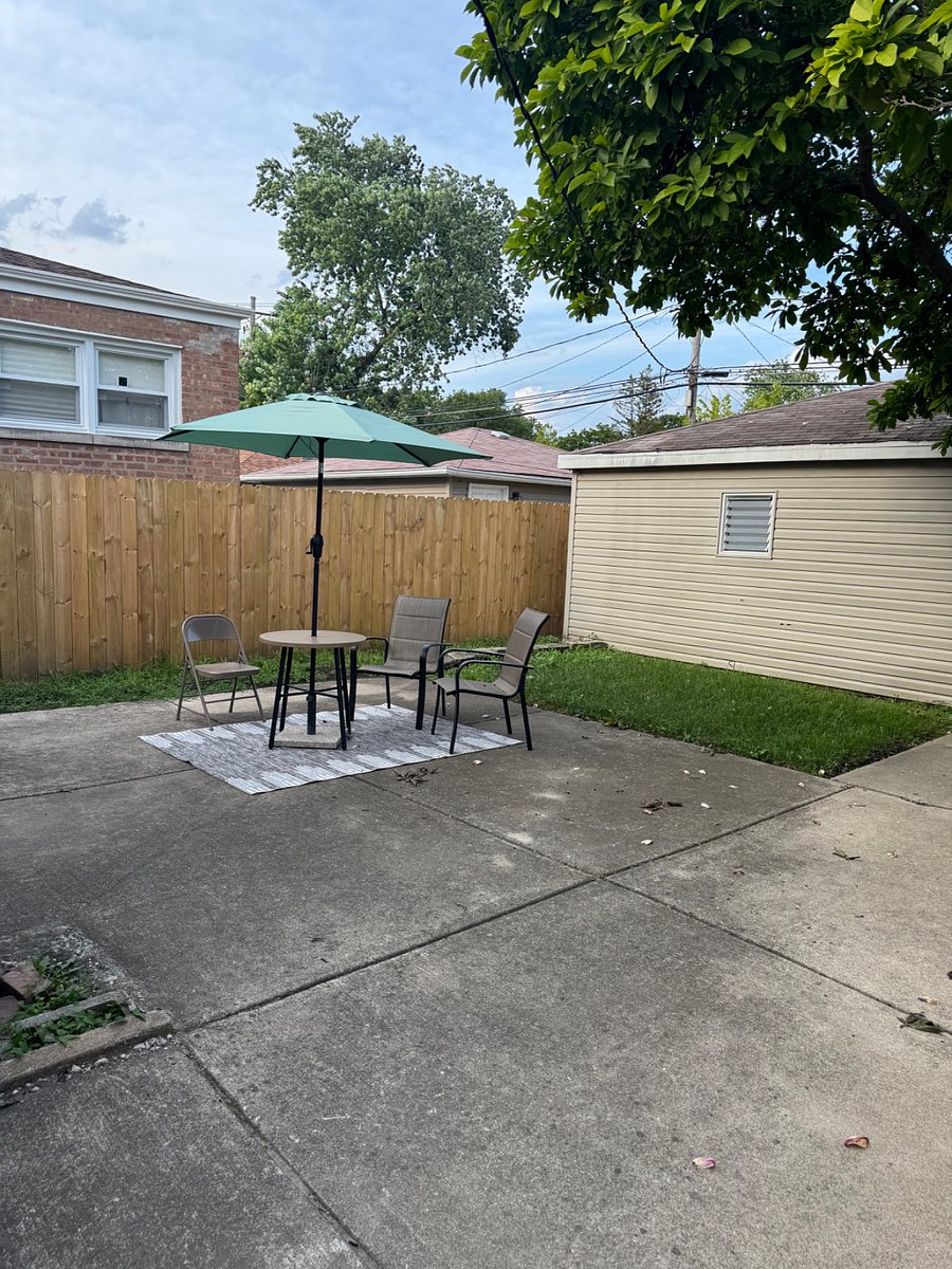 Fenced yard  with detached 2 car garage