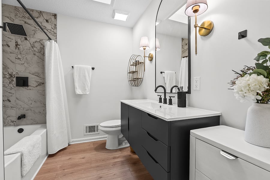 2nd bathroom located in the hallway with shower and tub. Sky light.