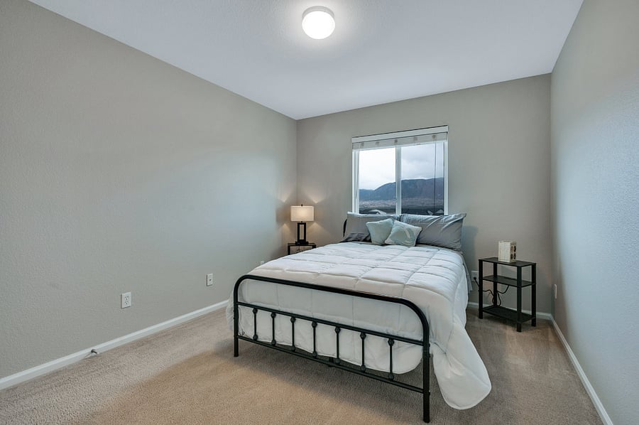 Full size bed in a room with mountain views!