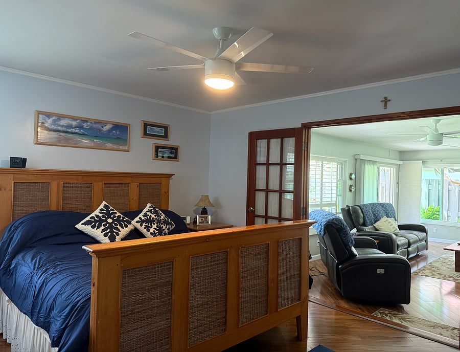 The primary bedroom opens up to living room.
