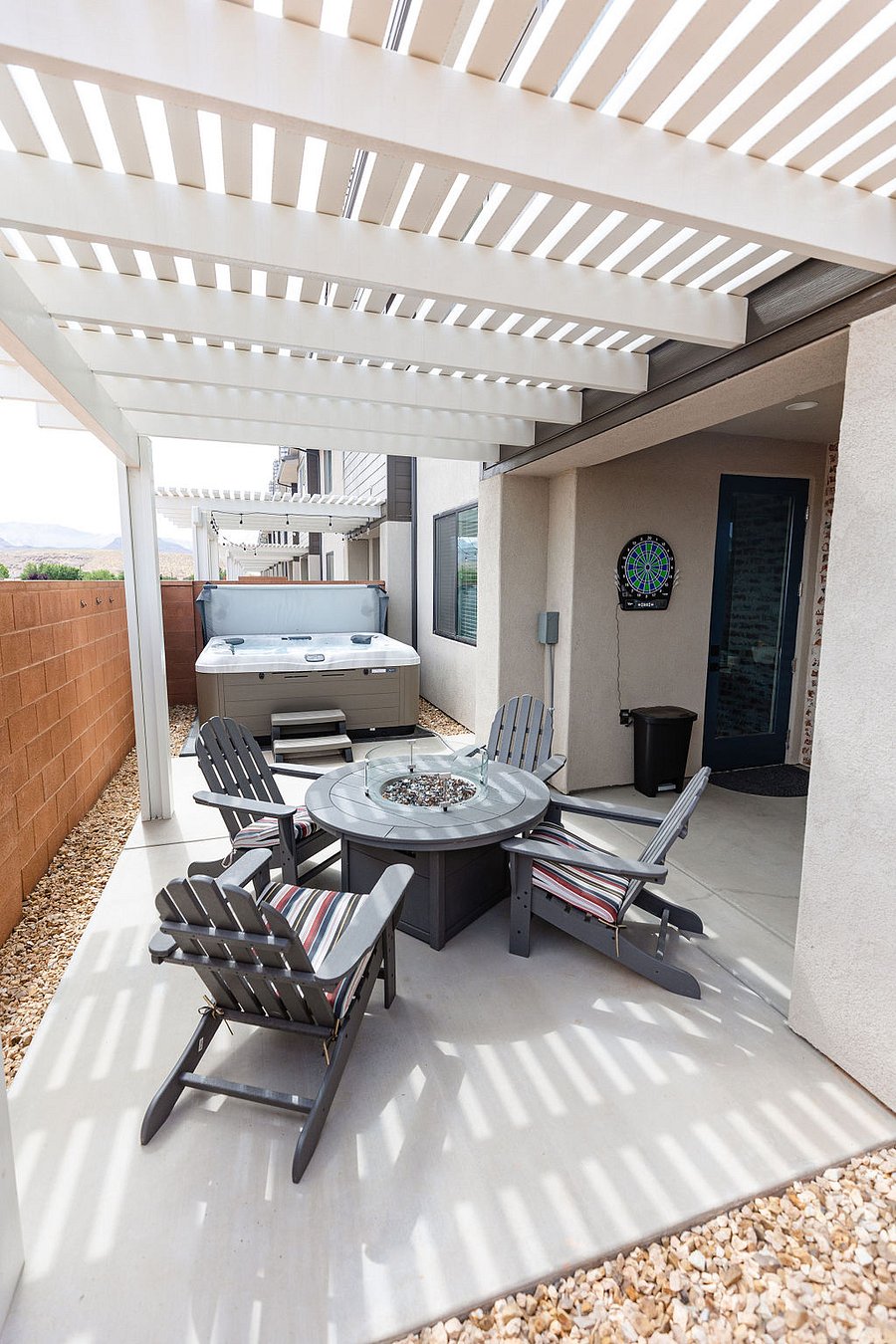 Gas fire table with comfortable seating and hot tub.
