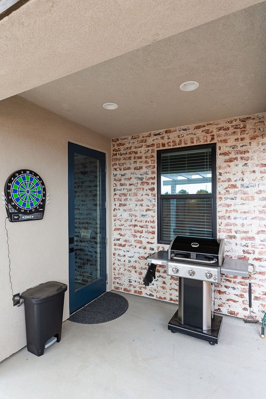 Gas grill and electronic dart board.