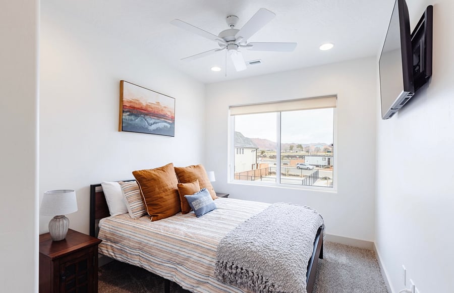 Queen bedroom with smart TV with blackout curtains (not shown)