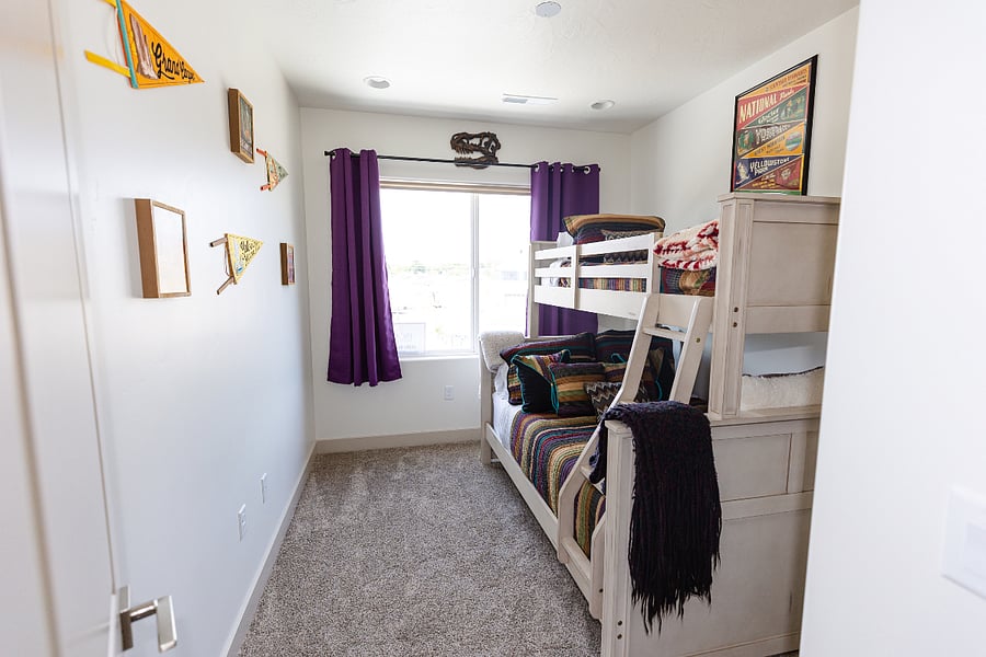 Third bedroom with twin/full bunkbeds and blackout curtains.