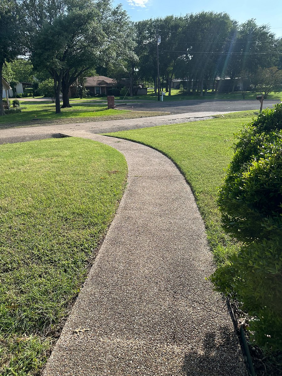 Tree shaded neighborhood with well kept next door houses.