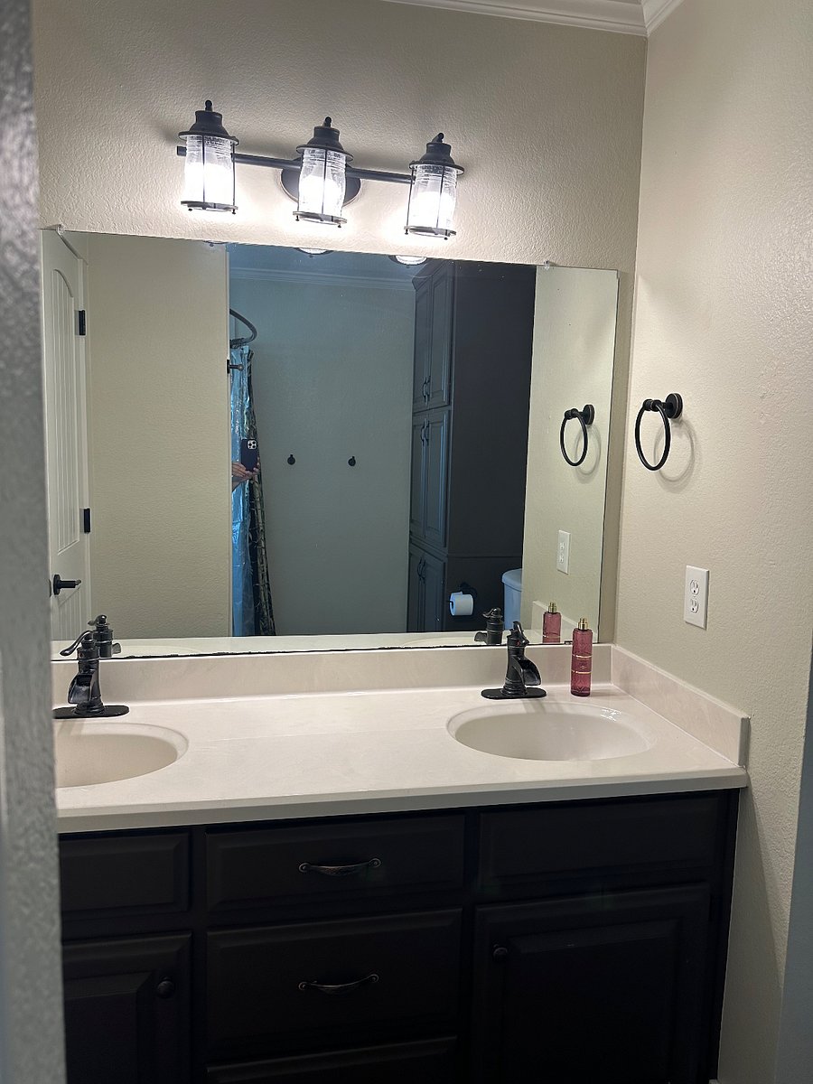 Master bath has double sinks with large, dual head shower.