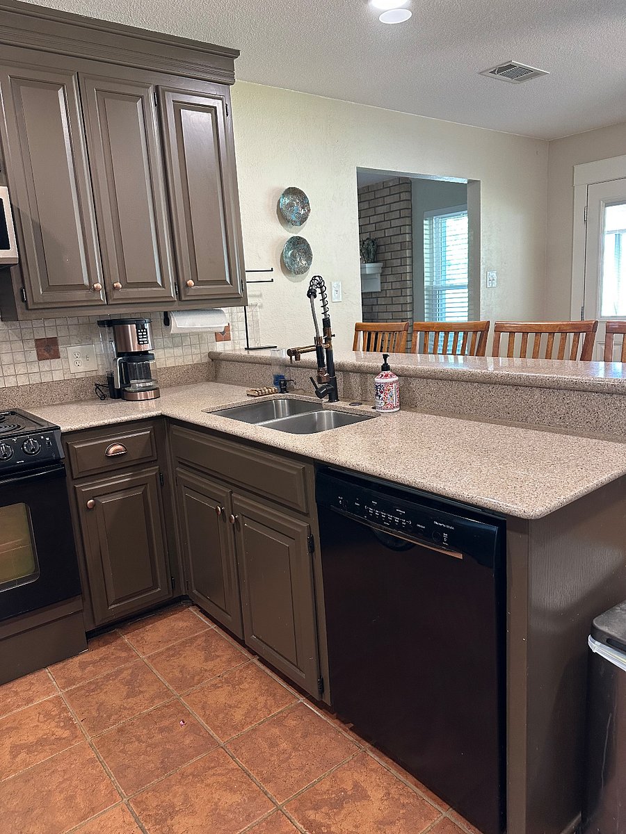 Well appointed kitchen with granite counters and breakfast bar.