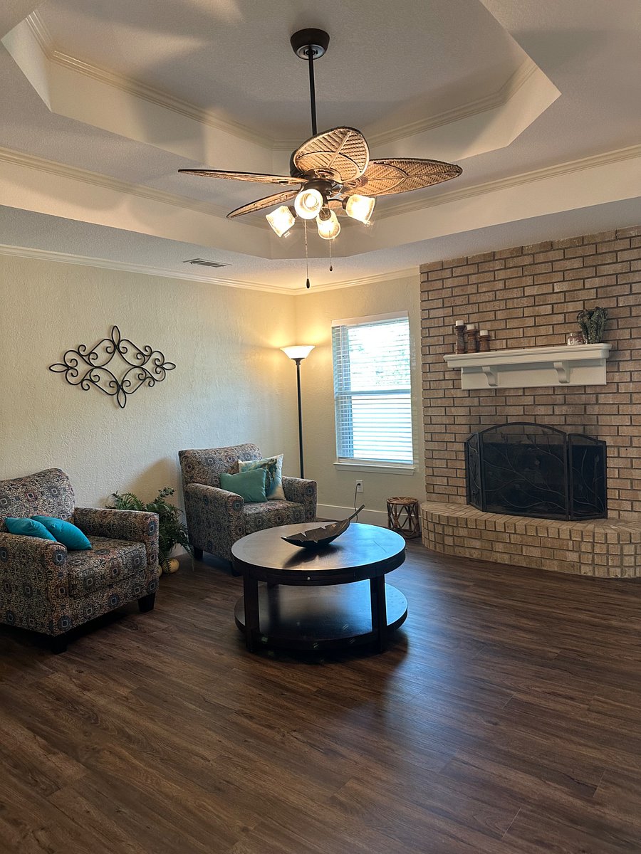 Cozy living room with ample seating and WBFP. 