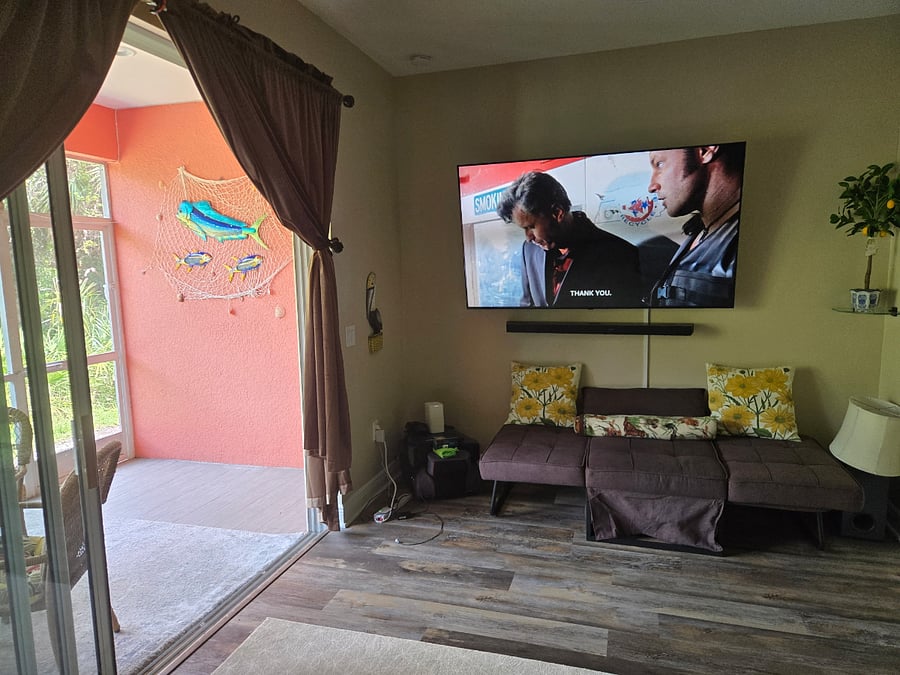 Glass doors opens to screened in lanai.