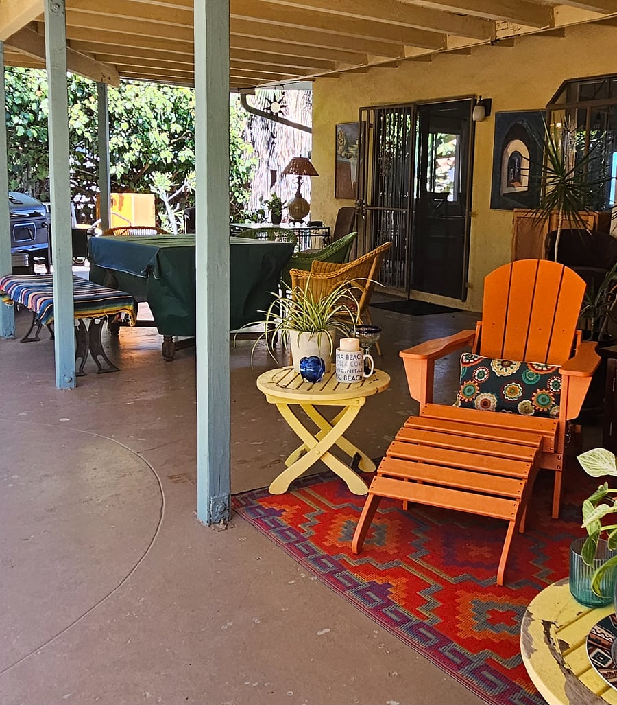 Covered patio with Adirondack chairs