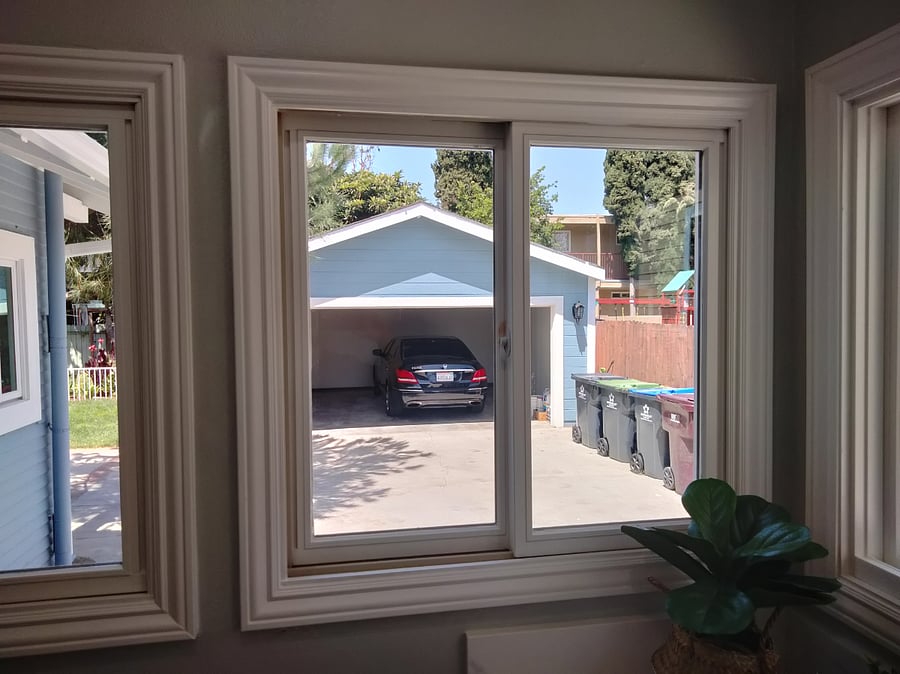 Detached 2-car garage in backyard at end of long driveway (view from laundry room at rear of house)