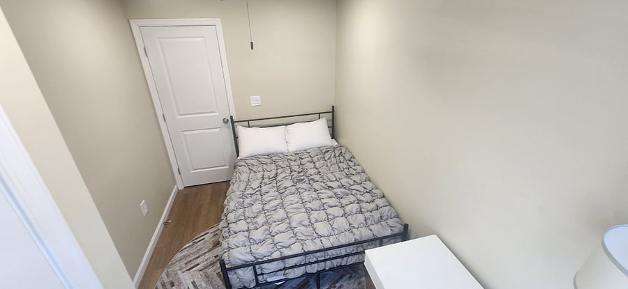 bedroom 2 with desk, bed, and closet.