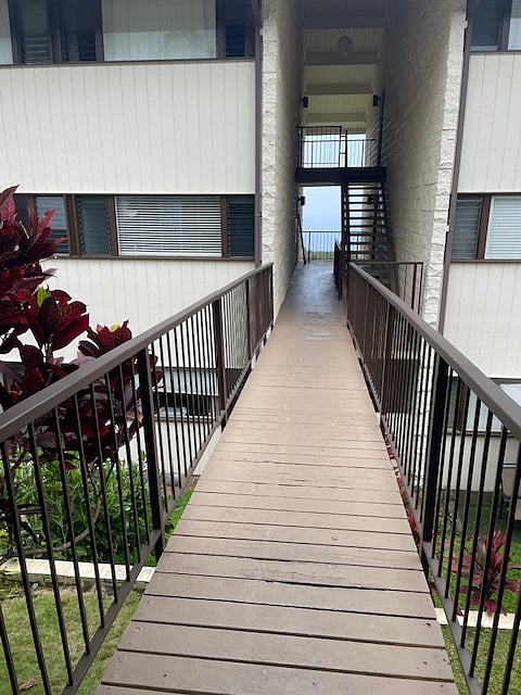 Bridge unit, no stairs. Assigned parking conveniently located right at entrance.