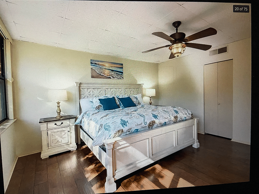 spacious master bedroom with smart TV