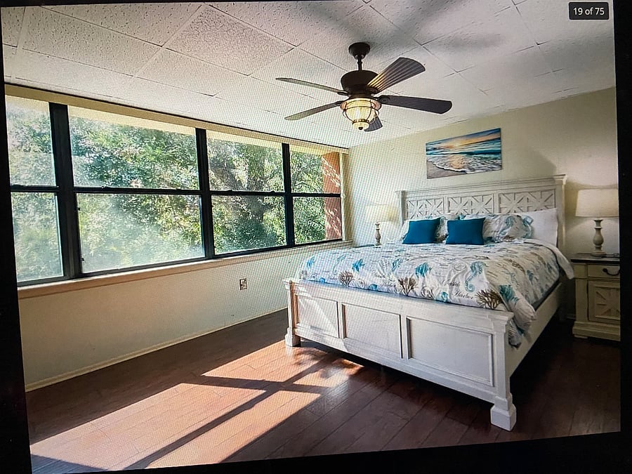 SPACIOUS MASTER BEDROOM WITH BEAUTIFUL VIEW OF OPEN SPACE BEHIND UNIT