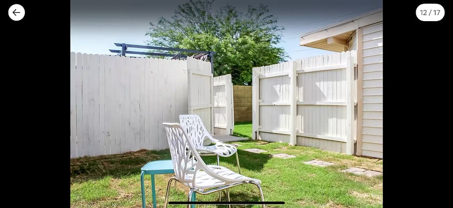 Gate from private yard leads to shared hot tub area.