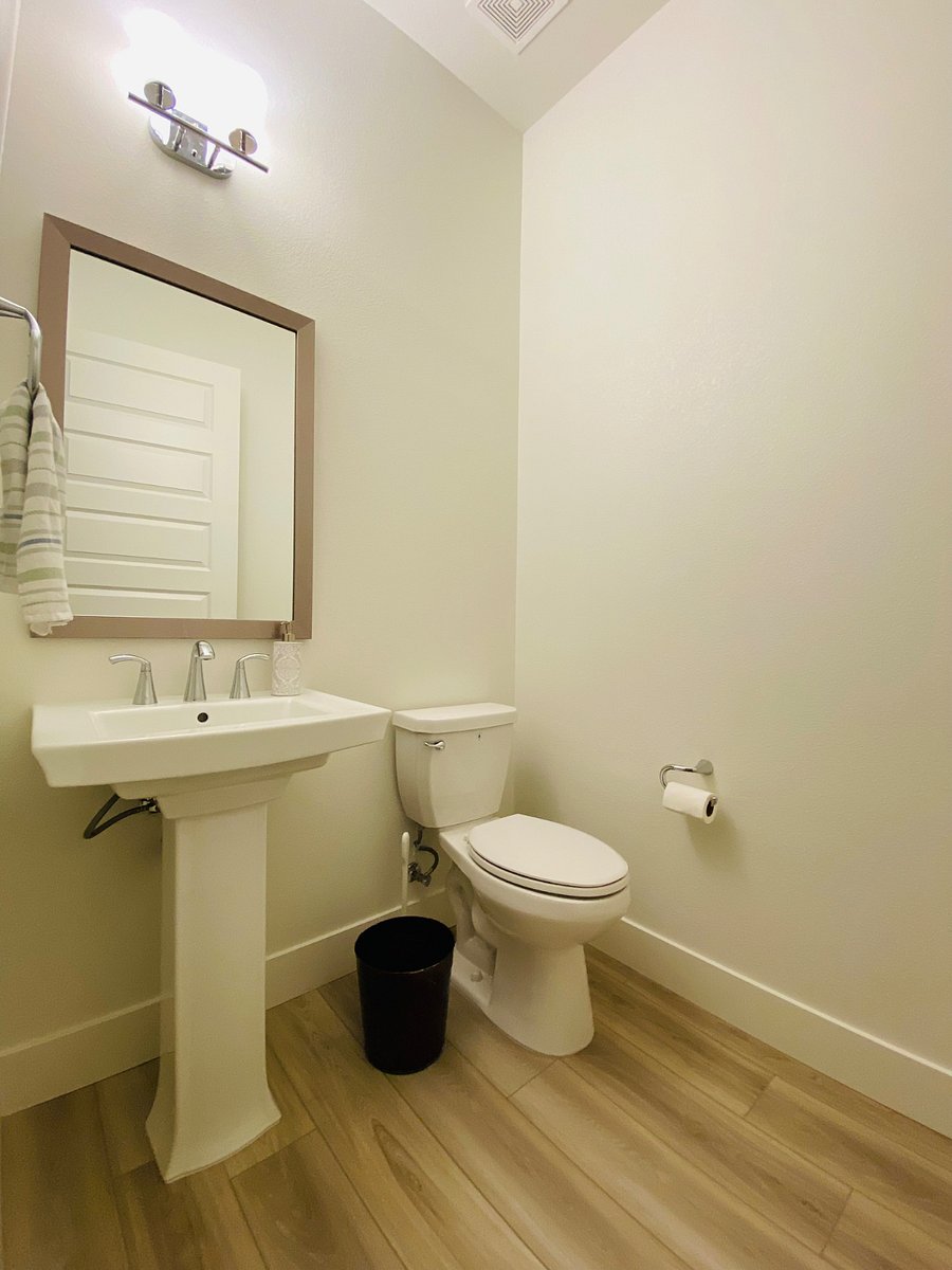 Powder room for guests near dining area
