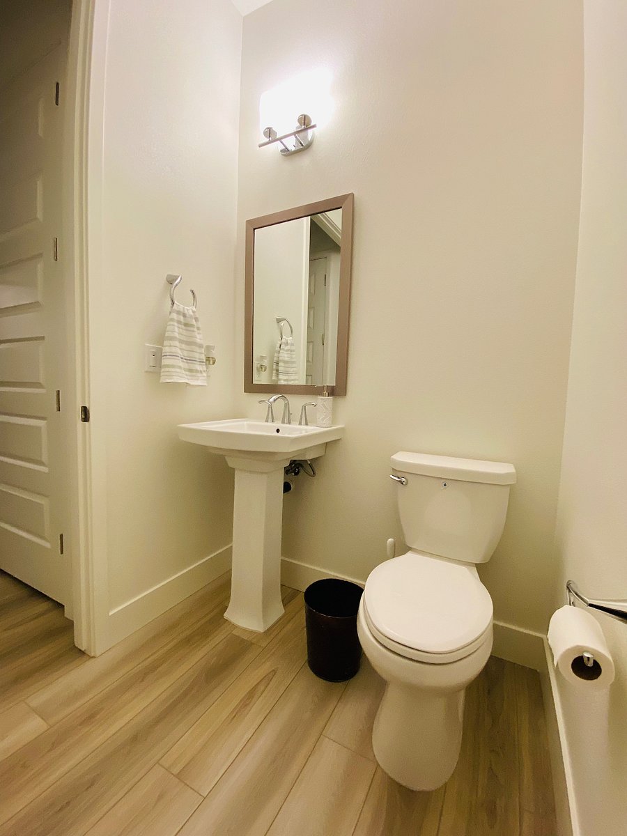 Powder room for guests near dining area