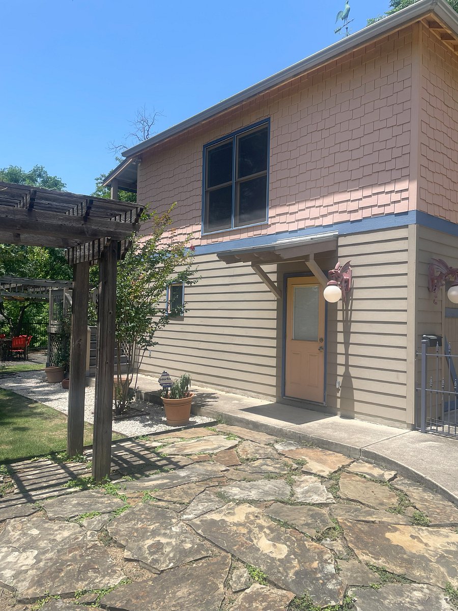View of side and stairs to apartment