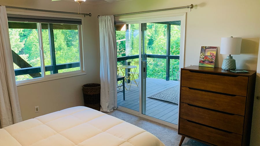 Access to deck from bedroom.  Light blocking shade in addition to the lined curtains.