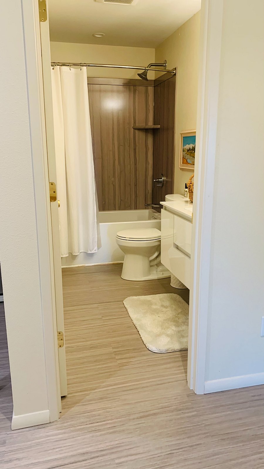 Take a stop here across from the bedroom.  Soaking tub with shower.  In room wall heater for toasty baths!