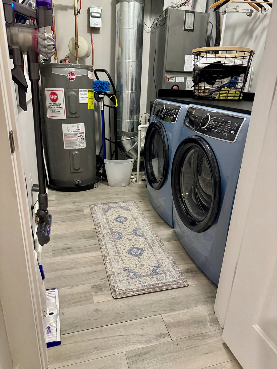 Laundry room with new Electrolux washer and dryer