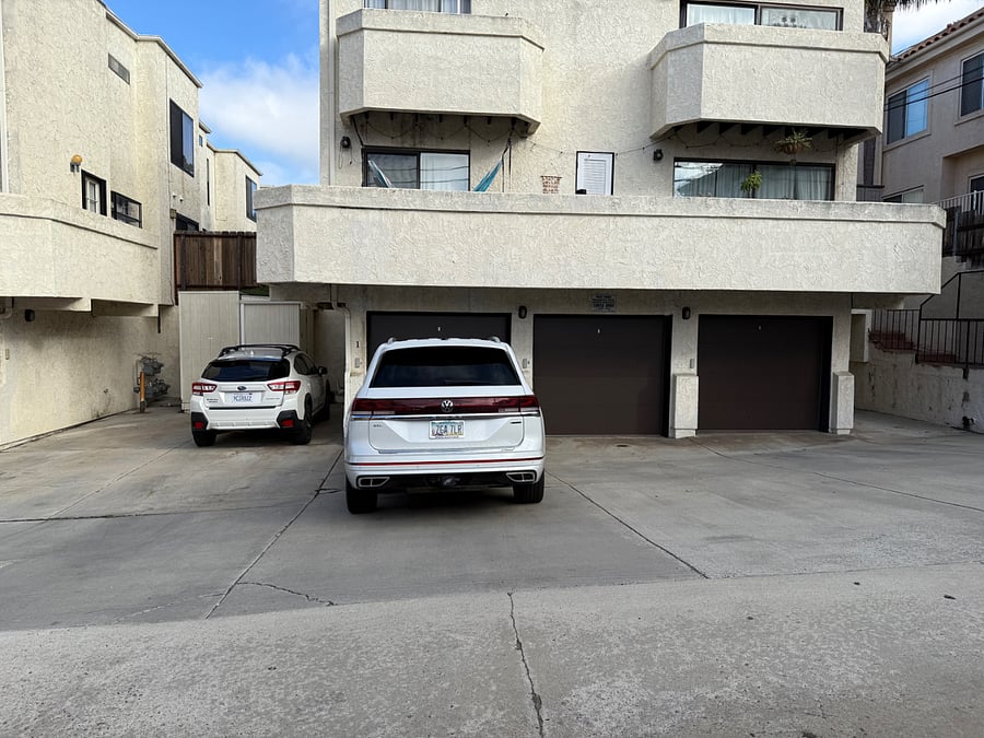 One Parking spot in the back - in front of the garage with #1. Garage is not part of the rental