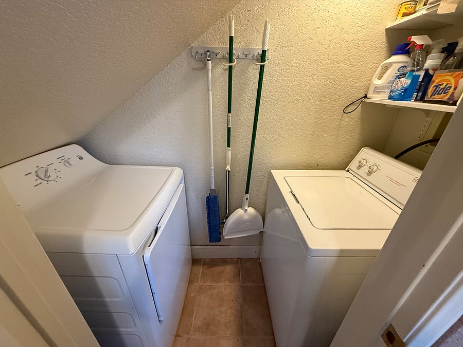 Washer and dryer in side closet of the kitchen