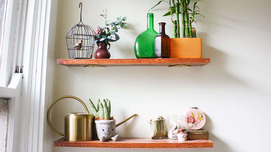Quirky and warm trinkets add a homey touch to your bathroom.