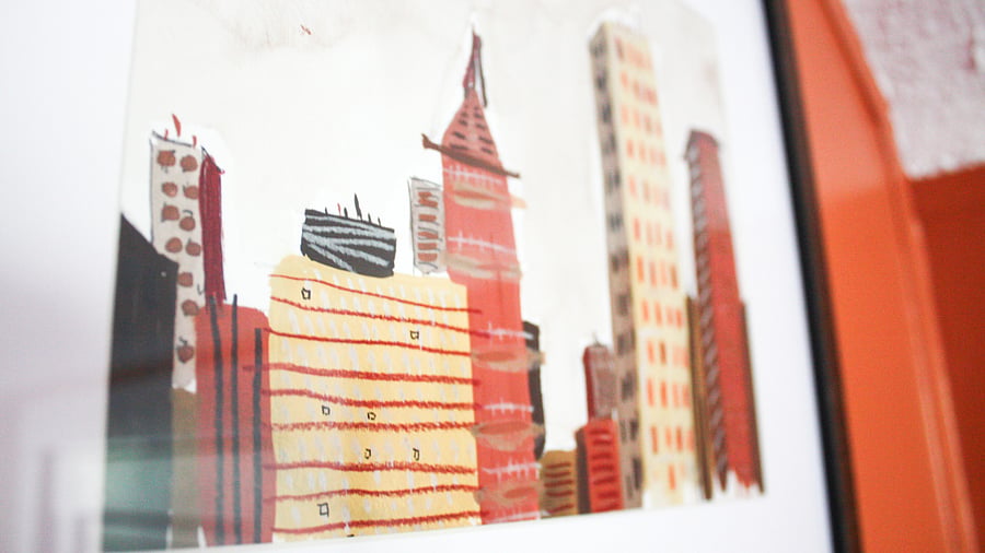 Eclectic artwork is scattered throughout the room.