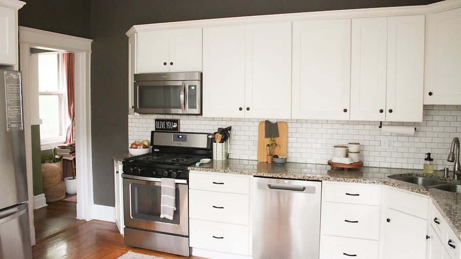The kitchen is fully equipped with a gas range, microwave, standing mixer, and other amenities/appliances.