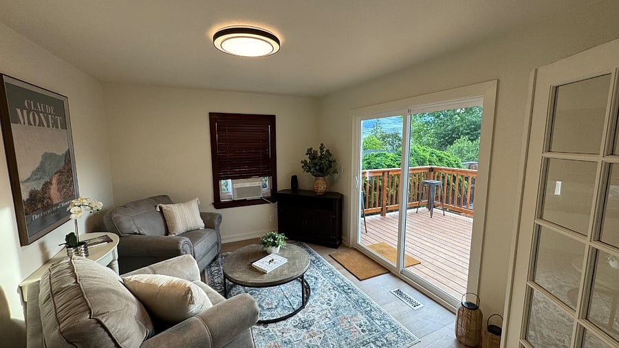 Sunroom leads out to a cedar deck.