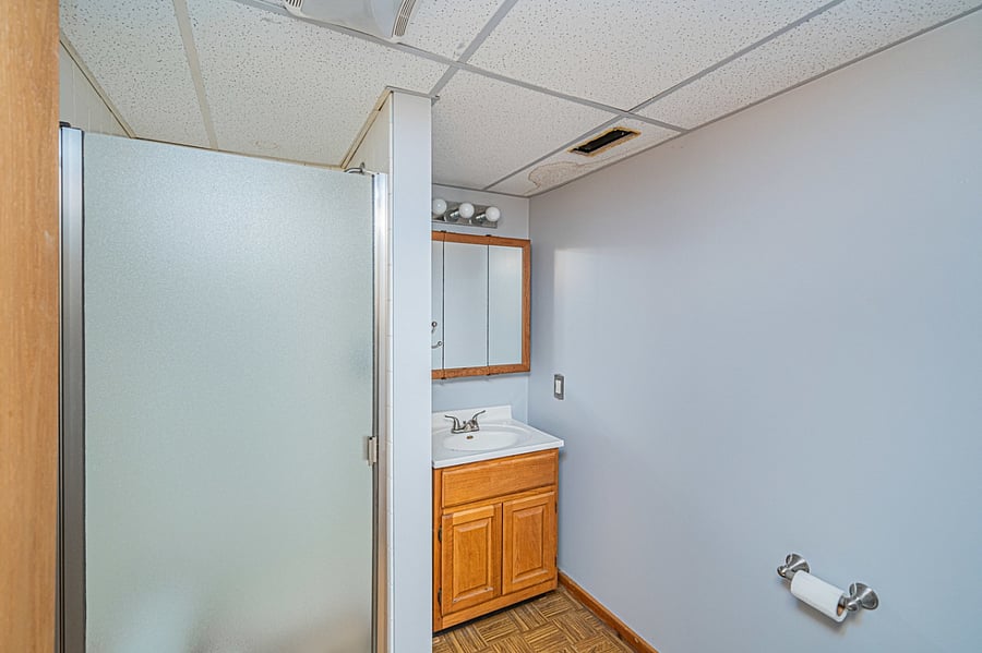 Private bathroom with stand up shower.