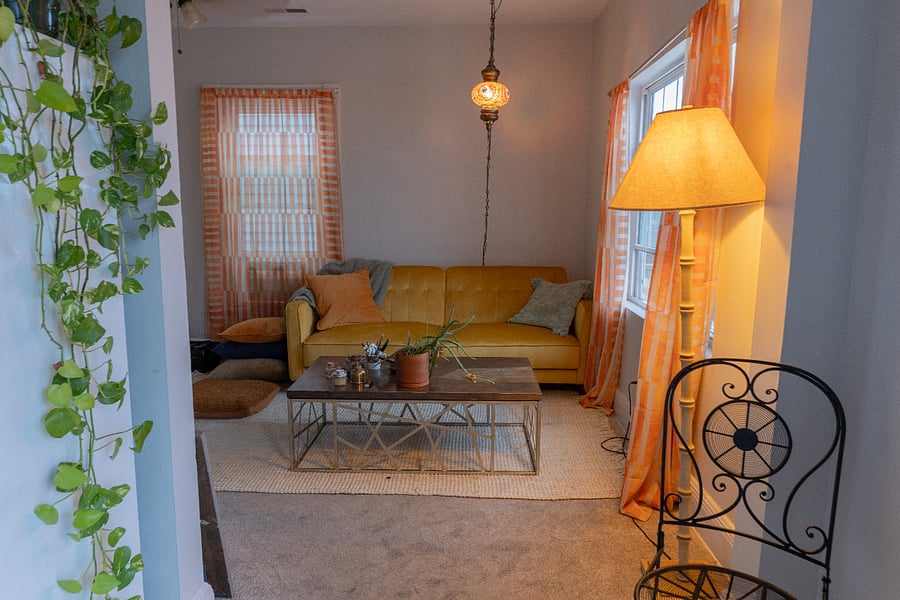 Couch unfolds to become a double bed for guests.