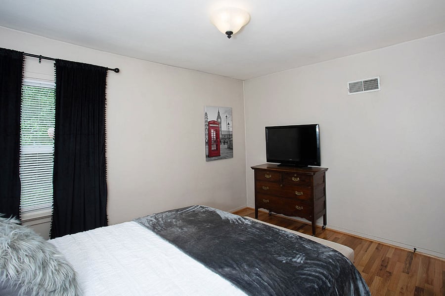 Front bedroom dresser and TV.