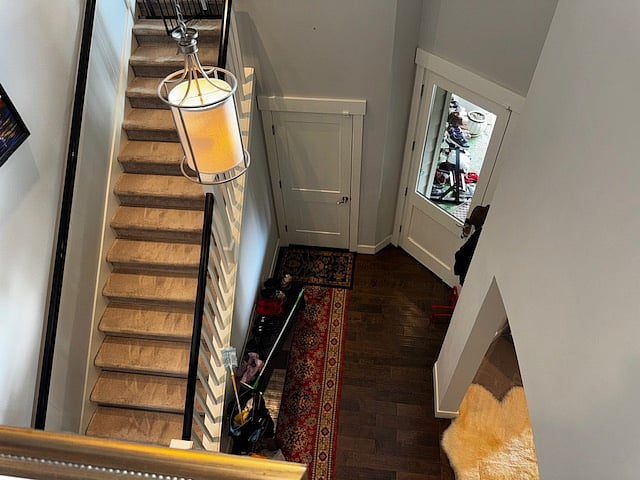 View of home entrance from upstairs.  Front door is 3/4 glass.