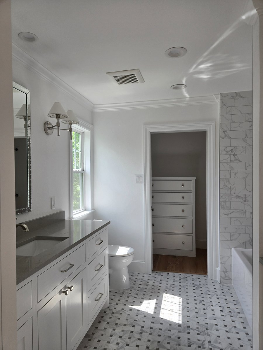 "Gray" Bathroom. Large closet with built in dresser. Linen closet and spacious cabinetry. 