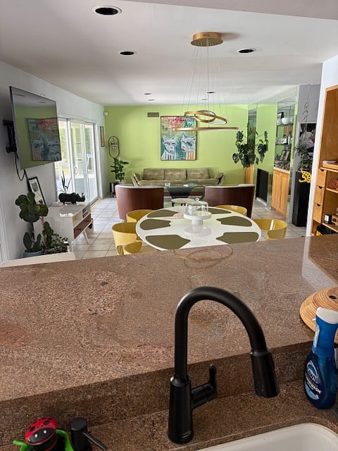 shot of easy fow living/dining room flowing into the kitchen