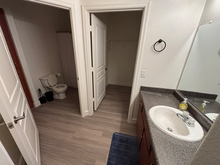 Primary bath with tub and shower, walk in closet.